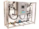 Chlorine dioxide generator system with control panel and piping for industrial water treatment applications.