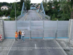 MUHR Flood Wall System in action, providing reliable flood protection with interlocking components and durable stainless steel construction.