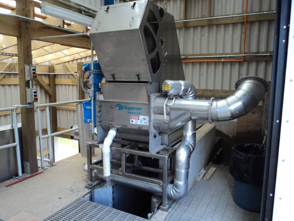 Duperon’s Low Flow System in action, combining FlexRake® technology with a washer compactor for efficient solids removal in municipal wastewater systems.